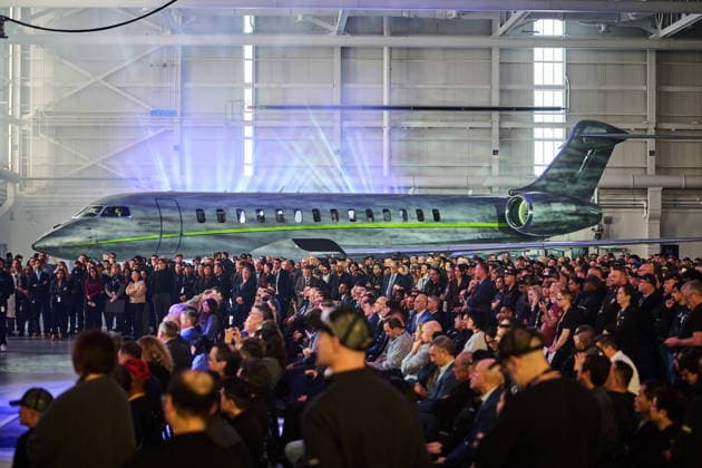 December 8, 2025, Mississauga, Ontario, Canada: Workers and media look on during an event celebrating Bombardier s Global 8000 aircraft entry-into-service at the company s aircraft assembly centre in Mississauga. With a top speed of Mach 0.95, otheur Bombardier Global 8000 is the world s fastest business jet and the fastest civil aircraft since the Concorde. Mississauga Canada  - ZUMAc35_ 20251208_zaf_c35_101 Copyright: xSammyxKoganx
