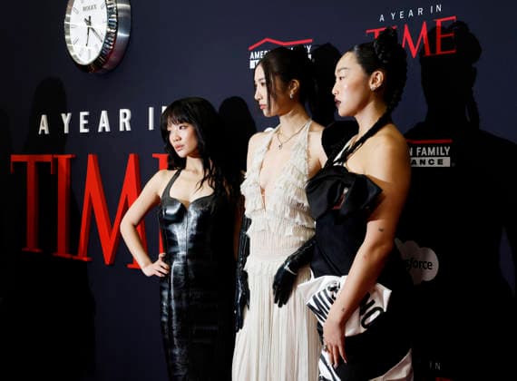 (L-R) Rei Ami, EJAE and Audrey Nuna arrive on the red carpet when TIME Celebrates A Year In TIME at Current at Chelsea Piers on Wednesday, December 10, 2025 in New York City. Rei Ami, EJAE, and Audrey Nuna are the vocalists behind the fictional K-Pop girl group HUNTR X in the popular Netflix animated musical movie K-Pop Demon Hunters.  NYP20251210101 JohnxAngelillo