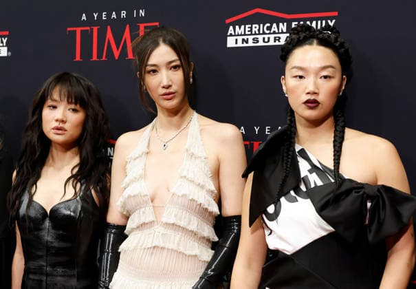 (L-R) Rei Ami, EJAE and Audrey Nuna arrive on the red carpet when TIME Celebrates A Year In TIME at Current at Chelsea Piers on Wednesday, December 10, 2025 in New York City. Rei Ami, EJAE, and Audrey Nuna are the vocalists behind the fictional K-Pop girl group HUNTR X in the popular Netflix animated musical movie K-Pop Demon Hunters.  NYP20251210103 JohnxAngelillo