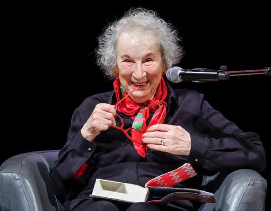 December 10, 2025, Calgary, Ab, CANADA: Margaret Atwood laughs as she prepares to read from her book while speaking with Heather O Neill during an on stage interview in Calgary, Wednesday, Dec. 10, 2025. Calgary CANADA  - ZUMAc35_ 20251210_zaf_c35_102 Copyright: xJeffxMcintoshx