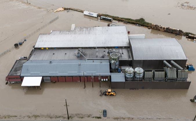 December 11, 2025, Vancouver, Bc, CANADA: Enviro-Corp Recycling is pictured flooded near the Sumas border crossing in Abbotsford B.C., on Thursday, December 11, 2025. Vancouver CANADA  - ZUMAc35_ 20251211_zaf_c35_056 Copyright: xEthanxCairnsx