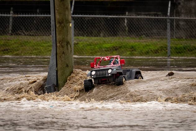 December 11, 2025, Vancouver, Bc, CANADA: A toy vehicle floats through floodwaters near the Sumas border crossing in Abbotsford B.C., on Thursday, December 11, 2025. Vancouver CANADA  - ZUMAc35_ 20251211_zaf_c35_057 Copyright: xEthanxCairnsx