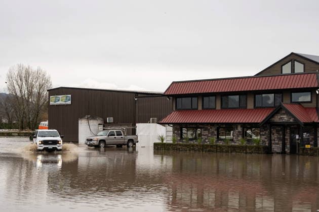 December 11, 2025, Vancouver, Bc, CANADA: A truck drives through floodwaters in Abbotsford B.C., on Thursday, December 11, 2025. Vancouver CANADA  - ZUMAc35_ 20251211_zaf_c35_061 Copyright: xEthanxCairnsx