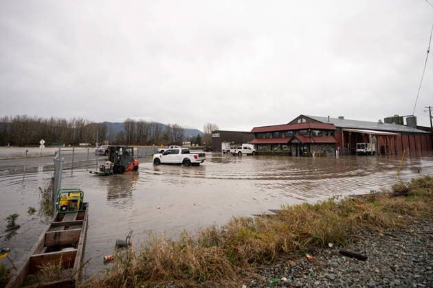 December 11, 2025, Vancouver, Bc, CANADA: A truck drives through floodwaters in Abbotsford B.C., on Thursday, December 11, 2025. Vancouver CANADA  - ZUMAc35_ 20251211_zaf_c35_062 Copyright: xEthanxCairnsx