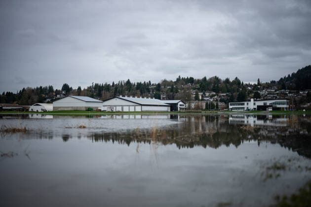 December 11, 2025, Vancouver, Bc, CANADA: Buildings surrounded by water are pictured in Abbotsford B.C., on Thursday, December 11, 2025. Vancouver CANADA  - ZUMAc35_ 20251211_zaf_c35_065 Copyright: xEthanxCairnsx