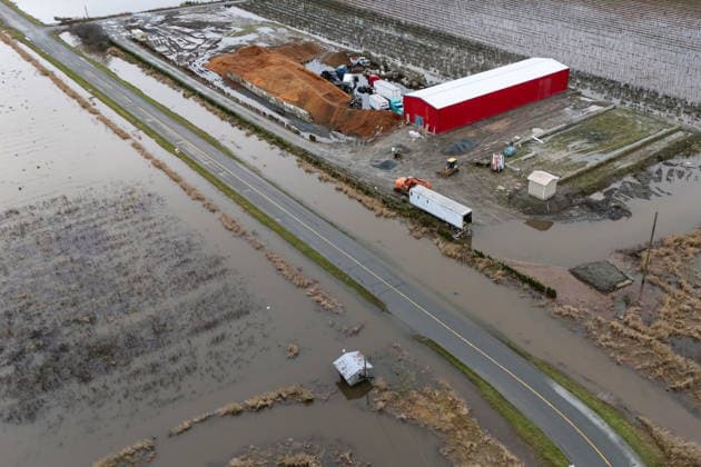 December 11, 2025, Vancouver, Bc, CANADA: A building surrounded by water is pictured in Abbotsford B.C., on Thursday, December 11, 2025. Vancouver CANADA  - ZUMAc35_ 20251211_zaf_c35_067 Copyright: xEthanxCairnsx