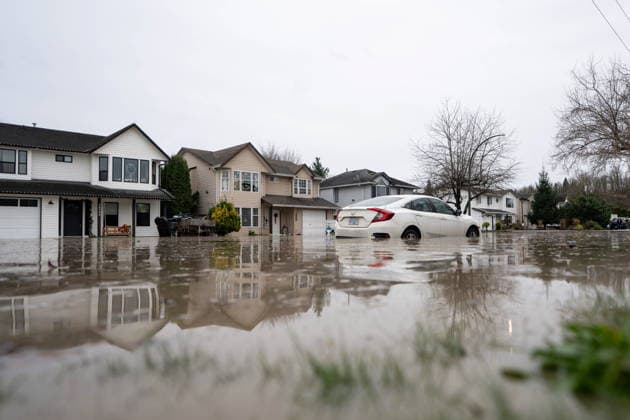 December 11, 2025, Vancouver, Bc, CANADA: A car surrounded by floodwaters is pictured in Abbotsford B.C., on Thursday, December 11, 2025. Vancouver CANADA  - ZUMAc35_ 20251211_zaf_c35_108 Copyright: xEthanxCairnsx