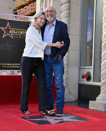 Director, producer and screenwriter James L. Brooks (R) is joined by his wife Jennifer Simchowitz during an unveiling ceremony honoring him with the 2,830th star on the Hollywood Walk of Fame in Los Angeles on Thursday December 11, 2025.  LAP2025121116 JIMxRUYMEN