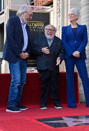 Director, producer and screenwriter James L. Brooks (L) is joined by Danny Devito (C) and Jamie Lee Curtis during an unveiling ceremony honoring him with the 2,830th star on the Hollywood Walk of Fame in Los Angeles on Thursday December 11, 2025.  LAP2025121125 JIMxRUYMEN