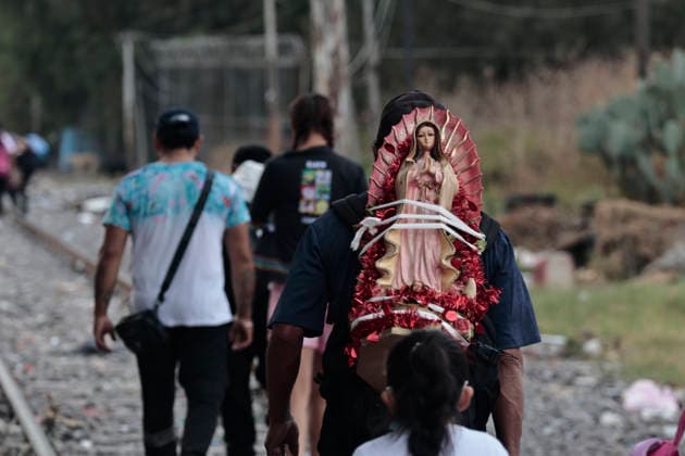 December 11, 2025, Nezahualcoyotl, State Of Mexico, Mexico: Walking with images and statues of the Virgin, pilgrims from Chimalhuacan and Nezahualcoyotl in the State of Mexico are heading to celebrate the Virgin of Guadalupe s birthday at the Basilica on Tepeyac Hill. Hundreds of people, alone or in groups, walk along the railroad tracks that cross past the Neza-Bordo Prison and what was once the largest garbage dump in Latin America. During the six- to eight-hour walk, some people give food as thanks for a miracle they believe the Virgin of Guadalupe has granted them; they also help the pilgrims reach their destination safely. Nezahualcoyotl Mexico - ZUMAp204 20251211_zip_p204_066 Copyright: xJosuexPerezx