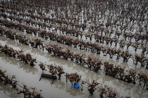 December 12, 2025, Abbotsford, Bc, CANADA: A table and bin is caught in a field after flooding in Abbotsford, B.C., Friday, Dec. 12, 2025. Abbotsford CANADA  - ZUMAc35_ 20251212_zaf_c35_050 Copyright: xEthanxCairnsx