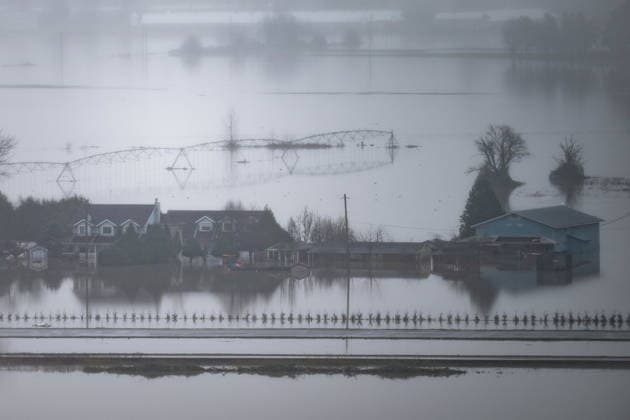 December 12, 2025, Abbotsford, Bc, CANADA: Floodwaters surround homes in Abbotsford, B.C., on Friday, Dec. 12, 2025. Abbotsford CANADA  - ZUMAc35_ 20251212_zaf_c35_056 Copyright: xEthanxCairnsx