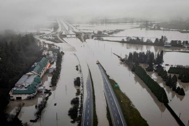 December 12, 2025, Abbotsford, Bc, CANADA: Highway 1 is pictured covered by floodwaters in Abbotsford, B.C., on Friday, Dec. 12, 2025. Abbotsford CANADA  - ZUMAc35_ 20251212_zaf_c35_064 Copyright: xEthanxCairnsx