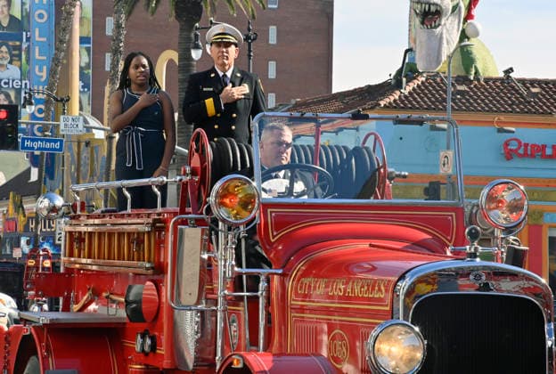 Eniola Taiwo and LAFD Chief Jaime E. Moore arrive for an unveiling ceremony honoring the Los Angeles Fire Department with an Award of Excellence star adjacent to the Hollywood Walk of Fame in Los Angeles on Tuesday, December 2, 2025.  LAP2025121202 JIMxRUYMEN