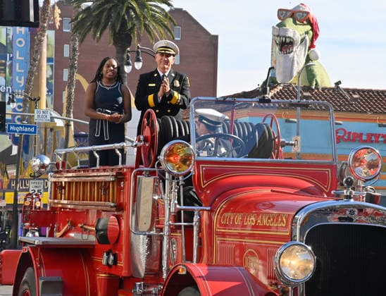 Eniola Taiwo and LAFD Chief Jaime E. Moore arrive for an unveiling ceremony honoring the Los Angeles Fire Department with an Award of Excellence star adjacent to the Hollywood Walk of Fame in Los Angeles on Tuesday, December 2, 2025.  LAP2025121204 JIMxRUYMEN