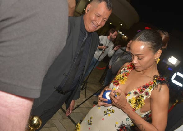 MIAMI, FLORIDA - DECEMBER 12: Zoe Saldana sign autograph for fans at the Miami Special Screening of Avatar: Fire and Ash at AMC Sunset Place 24 in Miami, Florida on December 12, 2025. Copyright: xmpi10 MediaPunchx
