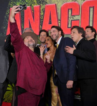 Cast member Jack Black takes a selfie of the cast during the world premiere of the motion picture horror comedy Anaconda at the United Theater in Los Angeles on Saturday, December 13, 2025. Storyline: A group of friends are going through a mid-life crisis. They decide to remake a favorite movie from their youth but encounter unexpected events when they enter the jungle.  LAP2025121373 JIMxRUYMEN