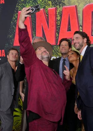 Cast member Jack Black takes a selfie of the cast during the world premiere of the motion picture horror comedy Anaconda at the United Theater in Los Angeles on Saturday, December 13, 2025. Storyline: A group of friends are going through a mid-life crisis. They decide to remake a favorite movie from their youth but encounter unexpected events when they enter the jungle.  LAP2025121383 JIMxRUYMEN