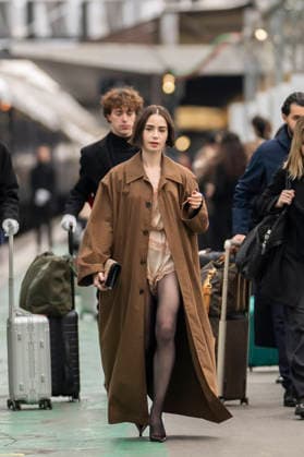 Emily in Paris cast - Paris Lily Collins arrives at Gare d’Austerlitz by the Orient Express in Paris, on December 14, 2025. Photo by Eliot Blondet ABACAPRES.COM Paris France France  Copyright: xBlondetxEliot ABACAx