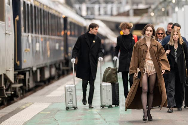 Emily in Paris cast - Paris Lily Collins arrives at Gare d’Austerlitz by the Orient Express in Paris, on December 14, 2025. Photo by Eliot Blondet ABACAPRES.COM Paris France France  Copyright: xBlondetxEliot ABACAx