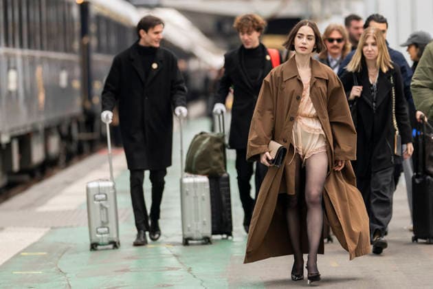 Emily in Paris cast - Paris Lily Collins arrives at Gare d’Austerlitz by the Orient Express in Paris, on December 14, 2025. Photo by Eliot Blondet ABACAPRES.COM Paris France France  Copyright: xBlondetxEliot ABACAx