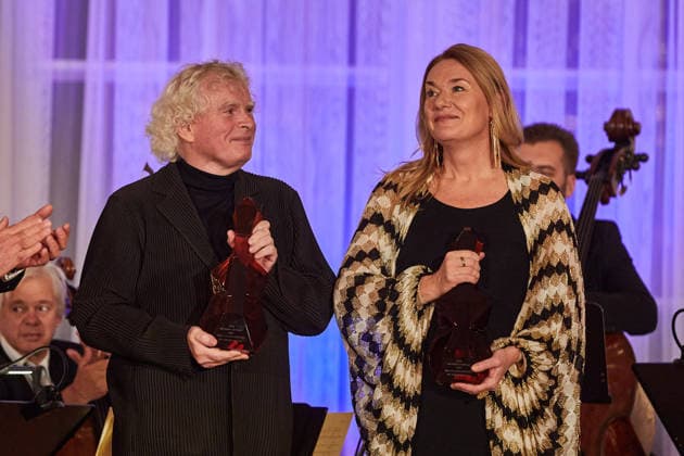 Mezzo-soprano Magdalena Kozena and her husband, British conductor Simon Rattle (left), received the Antonin Dvorak Award for 2025 from President Petr Pavel (not seen) in the Spanish Hall of Prague Castle, in Prague, on December 14, 2025. (CTKxPhoto DorotaxHolubova) CTKPhotoP2025121406655  CTKPhotoP2025121406655