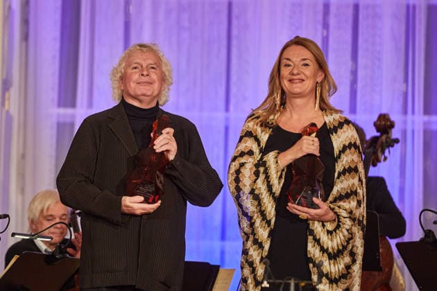 Mezzo-soprano Magdalena Kozena and her husband, British conductor Simon Rattle (left), received the Antonin Dvorak Award for 2025 from President Petr Pavel (not seen) in the Spanish Hall of Prague Castle, in Prague, on December 14, 2025. (CTKxPhoto DorotaxHolubova) CTKPhotoP2025121406656  CTKPhotoP2025121406656
