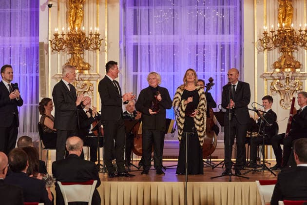 Mezzo-soprano Magdalena Kozena (2nd from right) and her husband, British conductor Simon Rattle (middle), received the Antonin Dvorak Award for 2025 from Czech President Petr Pavel (2nd from left) in the Spanish Hall of Prague Castle, in Prague, on December 14, 2025. (CTKxPhoto DorotaxHolubova) CTKPhotoP2025121406869  CTKPhotoP2025121406869