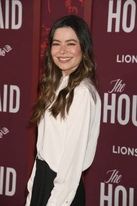 HOLLYWOOD, CA - DECEMBER 15: Miranda Cosgrove at the Los Angeles premiere of The Housemaid on December 15, 2025 at the TCL Chinese Theater in Hollywood, California. Copyright: xJeffreyxMayerx