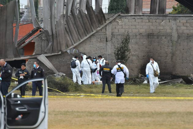 (251215) -- TOLUCA, Dec. 15, 2025 -- Personnel from the State of Mexico prosecutor s office work at the aircraft crash site in Toluca, the State of Mexico, central Mexico, Dec. 15, 2025. At least six people were killed Monday after a small aircraft crashed in the municipality of San Mateo Atenco in Mexico s central State of Mexico, local authorities said. (Photo by Xinhua) MEXICO-STATE OF MEXICO-TOLUCA-AIRCRAFT-CRASH ArturoxHernandez 
