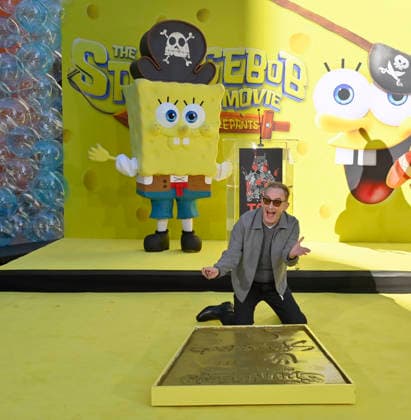 Tom Kenny, the voice of SpongeBob participates in a hand and footprint ceremony immortalizing SpongeBob in the forecourt of the TCL Chinese Theatre (formerly Grauman s) in the Hollywood section of Los Angeles on Tuesday, December 16, 2025.  LAP20251216401 JIMxRUYMEN