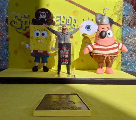 Tom Kenny, the voice of SpongeBob participates in a hand and footprint ceremony immortalizing SpongeBob in the forecourt of the TCL Chinese Theatre (formerly Grauman s) in the Hollywood section of Los Angeles on Tuesday, December 16, 2025.  LAP20251216415 JIMxRUYMEN