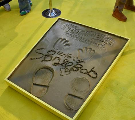 SpongeBobs hands and footprints are on display following a ceremony immortalizing SpongeBob in the forecourt of the TCL Chinese Theatre (formerly Grauman s) in the Hollywood section of Los Angeles on Tuesday, December 16, 2025.  LAP20251216419 JIMxRUYMEN