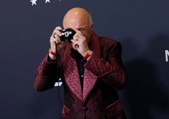 Kevin O Leary takes a photo with a camera when he arrives on the red carpet for A24 s Marty Supreme New York Premiere on Tuesday, December 16, 2025 in New York City.  NYP20251216143 JohnxAngelillo