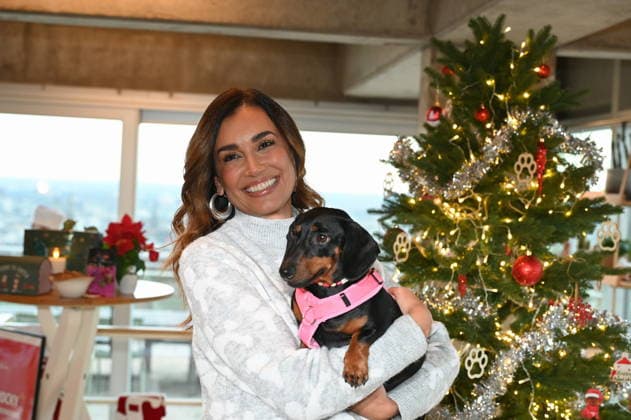 Jana Ina Zarrella poses with her dog Mimi at the presentation of dog cookies alla Stefano Zarrella un Biscotto per Naturale in cooperation with the premium dog food manufacturer Animonda