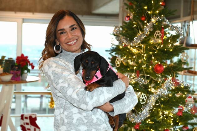 Jana Ina Zarrella poses with her dog Mimi at the presentation of dog cookies alla Stefano Zarrella un Biscotto per Naturale in cooperation with the premium dog food manufacturer Animonda