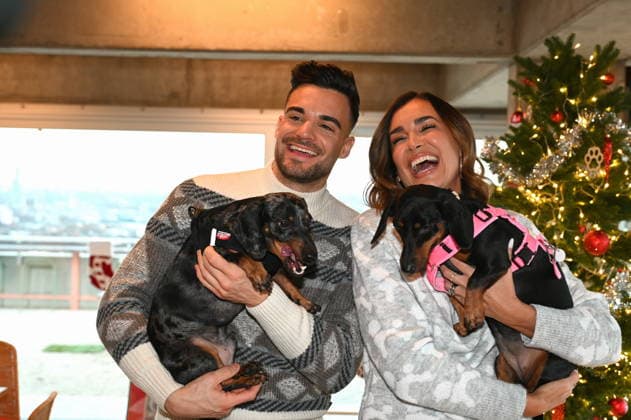 Stefano Zarrella with dog Rocky and Jana Ina Zarrella with dog Mimi pose at the presentation of dog cookies alla Stefano Zarrella un Biscotto per Naturale in cooperation with the premium dog food manufacturer Animonda