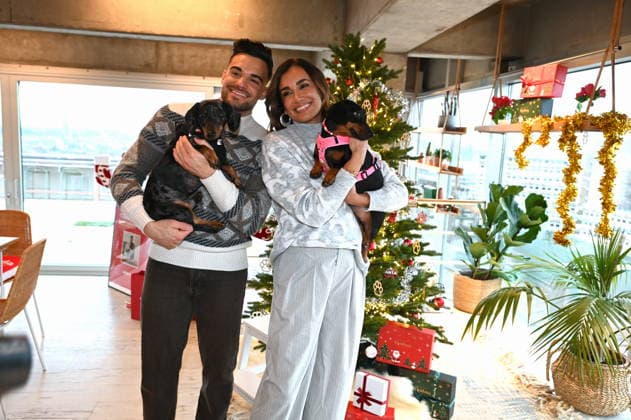 Stefano Zarrella with dog Rocky and Jana Ina Zarrella with dog Mimi pose at the presentation of dog cookies alla Stefano Zarrella un Biscotto per Naturale in cooperation with the premium dog food manufacturer Animonda