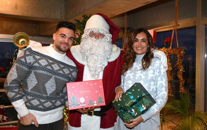 Stefano Zarrella, Christmas man, Jana Ina Zarrella, l r,poses at the presentation of dog cookies alla Stefano Zarrella un Biscotto per Naturale in cooperation with the premium dog food manufacturer Animonda