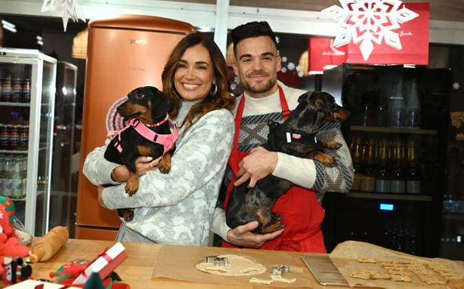 Jana Ina Zarrella with dog Mimi, Stefano Zarrella with dog Rocky poses at the presentation of dog cookies alla Stefano Zarrella un Biscotto per Naturale in cooperation with the premium dog food manufacturer Animonda