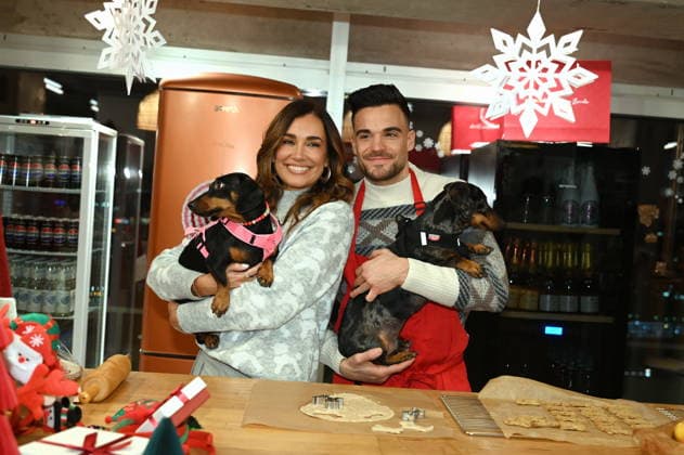 Jana Ina Zarrella with dog Mimi, Stefano Zarrella with dog Rocky poses at the presentation of dog cookies alla Stefano Zarrella un Biscotto per Naturale in cooperation with the premium dog food manufacturer Animonda