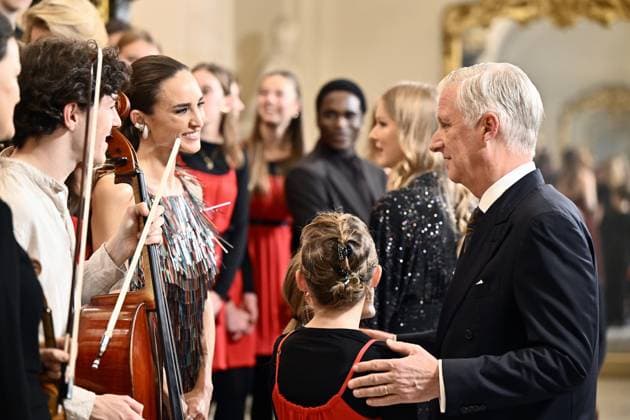 Thyph Barrow and King Philippe - Filip of Belgium pictured during the yearly Christmas Concert at the Royal Palace in Brussels, Wednesday 17 December 2025.  ERICxLALMAND 149638534