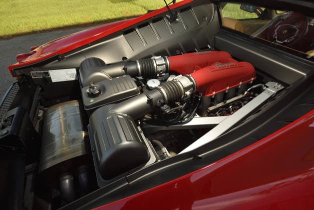 Donald Trump’s old Ferrari selling for £750,000 Story From Jam Press (Donald Trump Ferrari) Pictured: Donald Trump’s 2007 Ferrari F430 F1 engine. Donald Trump’s old Ferrari selling for £750,000 Donald Trump’s old Ferrari is being sold for £750,000. The US President got the classic red F430 F1 brand new in 2007. It was ten years before he was elected to the White House. He was hosting the US version of The Apprentice at the time. It would have set him back about £120,000 when he got it 18 years ago. The 196mph supercar was delivered to the now 79-year-old Trump Tower in New York City. The car is being sold with Trump’s distinctive signature on the paperwork. The Ferrari boasts a 4.3 litre V8 engine and has only done 9,493 miles. T  Copyright: xJamxPress PhotosxCourtesyxofxMecumxAuctions,xInc.