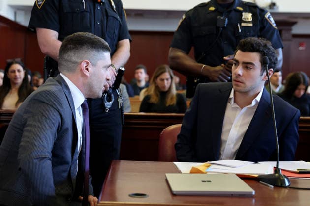 Luigi Mangione confers with his attorney, Jacob Kaplan, as he appears in Manhattan Supreme Court for a suppression hearing in the murder of UHC CEO Brian Thompson on Tuesday, December 18, 2025 in New York City. Pool  NYX20251218111 LuizxC.xRibeiro