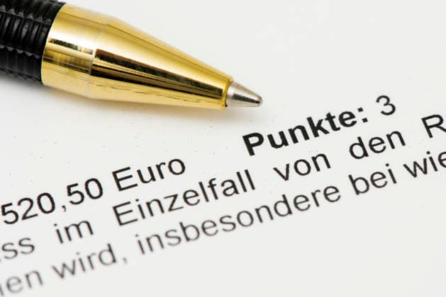 Notice of fine A notice of fine for a traffic violation against the StVo as a symbolic image for a fine and points