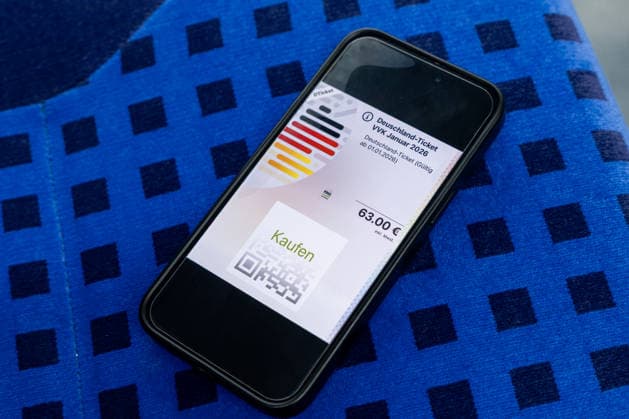 Digital Deutschlandticket with new price 17 12 25, Limburg Symbol photo, illustration image, symbol image, illustration photo, everyday scene A smartphone shows the digital Deutschlandticket with a price of 63 euros The cell phone is lying on a seat in Copyright: xThorstenxWagnerx