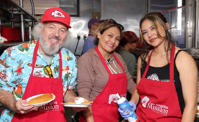 19 December 2025 - Los Angeles, California - Clint Howard, Kat Howard and Rafa ella Erlinda Hope The Mission And Los Angeles Mission Host Annual Christmas Celebration On Skid Row held at Los Angeles Mission in Los Angeles. Photo Copyright: xAdMediax MediaPunchx
