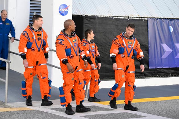 The Artemis II crew, Victor Glover and Reid Wiseman (front l r) with Jeremy Hansen and Christina Koch (rear l r) conduct a walkout from the Operations and Checkout Building at the Kennedy Space Center, Florida on Saturday December 20, 2025. The crew will participate in a Countdown Demonstration Test as they prepare for their mission to the moon which is scheduled for no earlier than Feb 2026.  KSP20251220003 JOExMARINO