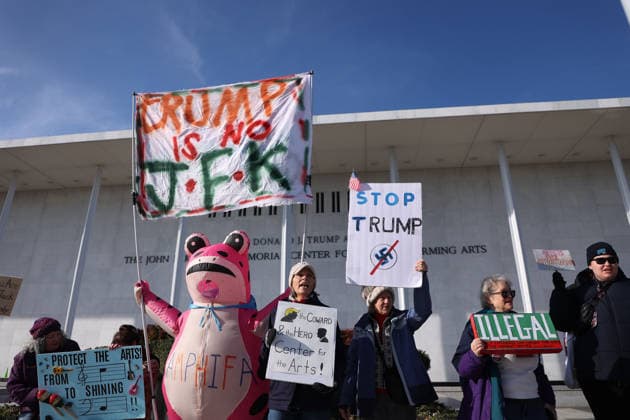 Protest against the name of Donald J. Trump to the Kennedy Center In Washington DC, USA. Demonstrators hold signs as they protest in front of the John F. Kennedy Memorial Center for the Performing Arts building, in Washington, D.C., USA, on December 20, 2025. Activists opposed adding the name Donald J. Trump to the Kennedy Center for the Performing Arts. Washington DC USA  Copyright: xMatrixxImagesx xGentxShkullakux