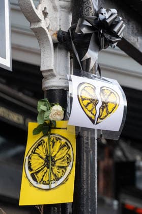 Paintings of a lemon and roses adorn the side of the road ahead of the funeral procession of Gary Mani Mounfield, Bass Player in the Stone Roses and Primal Scream, in Heaton Moor, Stockport on 22 December 2025. The Stone Roses dopted the lemon as a symbol of rebellion and counter-culture, featuring it prominently on their iconic debut album cover. 22 12 2025 Stockport Greater Manchester England Heaton Moor  Copyright: xMattxWilkinsonx